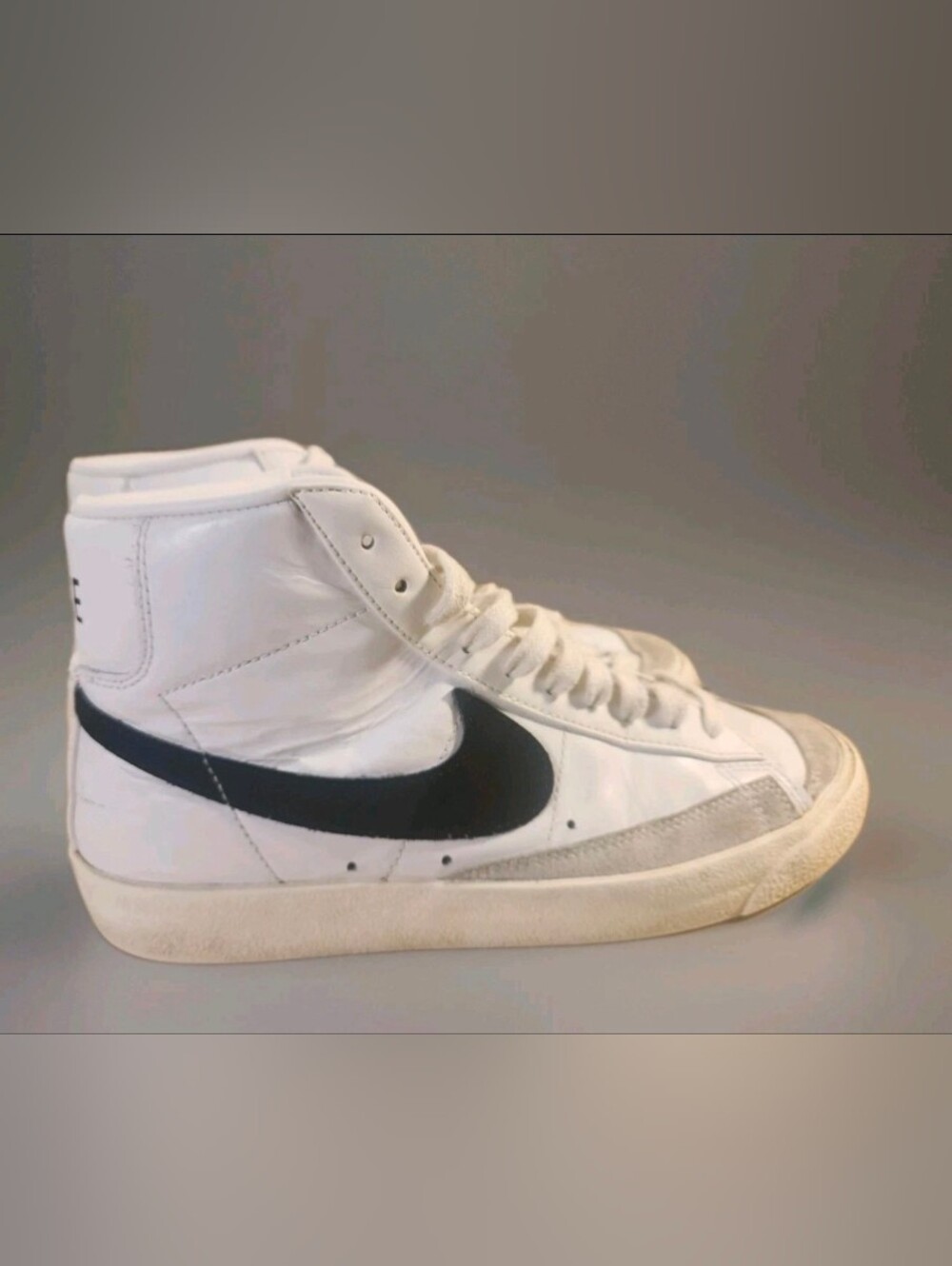 Nike Men’s White High-Top Sneaker with Black Swoosh Accent